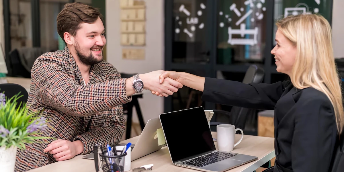 Woman saying goodbye to customer