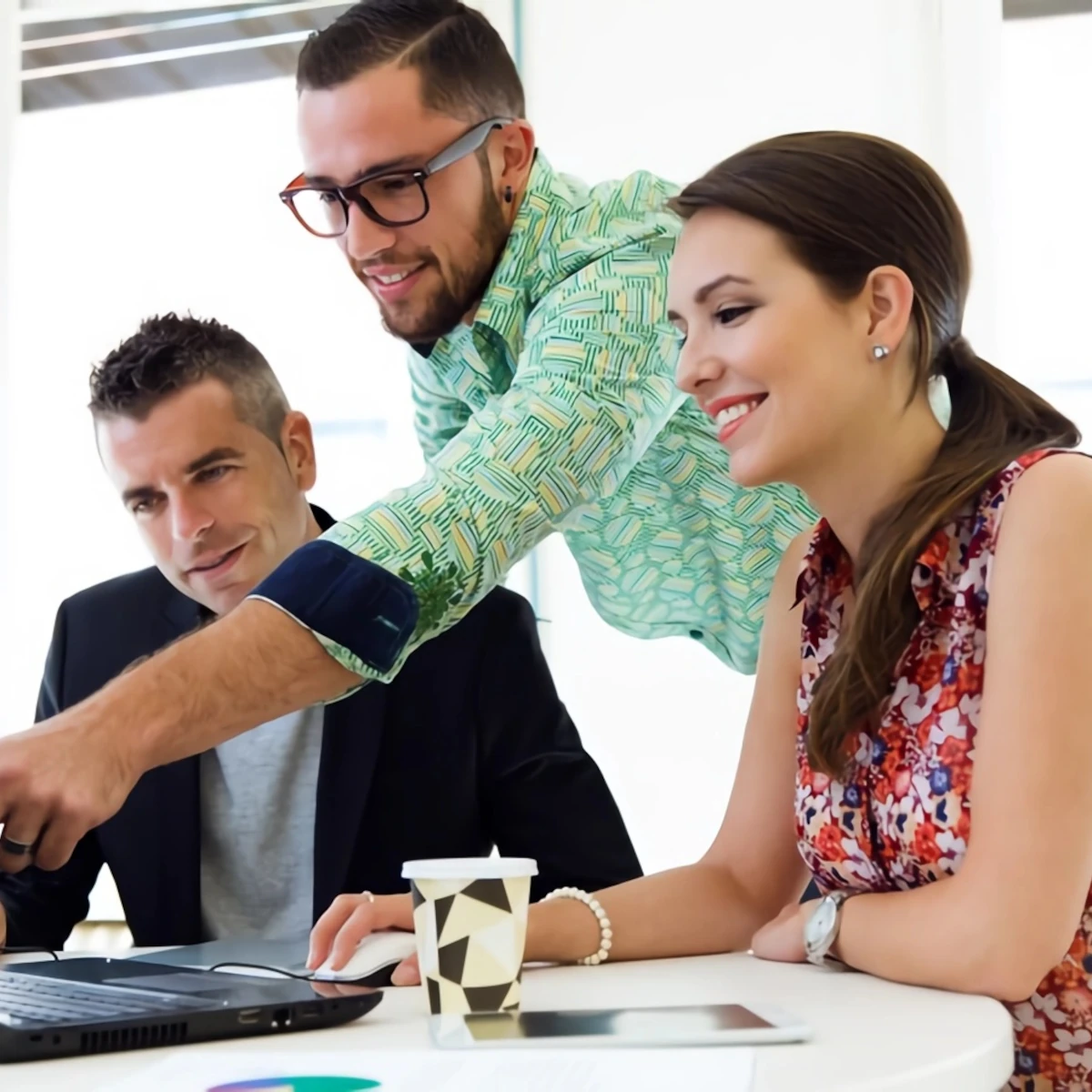 Work supervisor helping colleagues