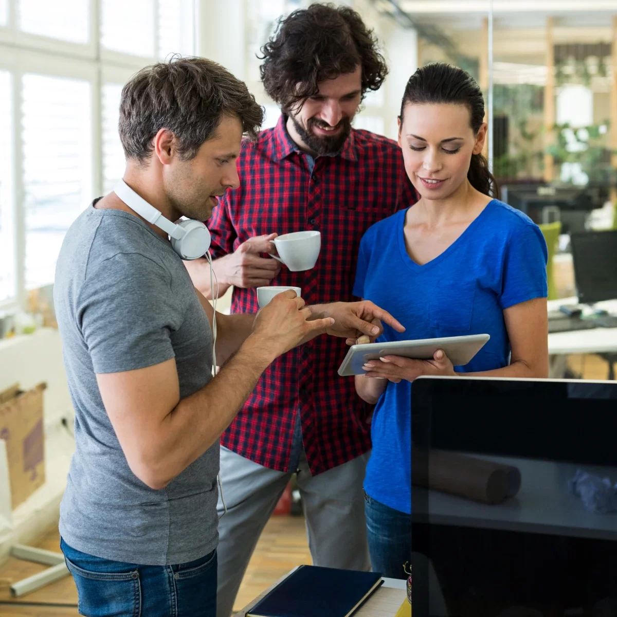 work group looking at a tablet